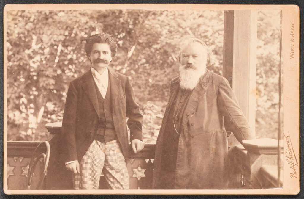 Photo of Strauss and Brahms on a balcony